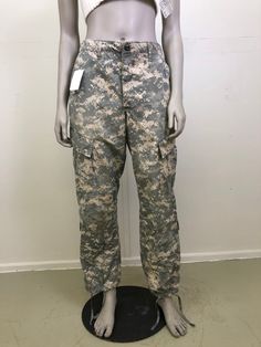 "Vintage camo army pants in a size small short fit. Tie waist and ties at the ankles for versatile styling. Great worn oversized. Button fly and lots of pockets. In great condition with no major flaws.  Fits small  30\" waist but can be tied smaller 40\" hips  11\" rise  29\" inseam" Full Length Camouflage Military Bottoms, High Waist Camouflage Military Bottoms, Fitted Camouflage Military Pants, Military Style High Waist Parachute Pants In Khaki, Military Style High Waist Khaki Parachute Pants, High Waist Camouflage Combat Pants, Spring Military Style Outdoor Bottoms, Spring Camouflage Full-length Cargo Pants, Fitted Camouflage Bottoms For Outdoor