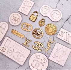 many different types and sizes of metal stamping on the ground with numbers, letters, and symbols