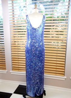 "This is a STUNNING evening gown by Oleg Cassini. It's heavily embellished with glass beading and sequins. It's in excellent condition! Measurements: Bust - 32/34\" Waist - 28/30\" Hips - 36/38\" Length - 55\" This dress comes from a pet-free and smoke-free home. If you would like more info or have any questions, please don't hesitate to ask!" Full Length Sequin Evening Gown, Sequined Full Length Evening Gown, Sequined Full-length Evening Gown, Full-length Sequin Gown For Prom Season, Sequin Full-length Evening Dress For Party Season, Full-length Sequined Evening Dress For Party Season, Blue Floor-length Sequin Dress, Iridescent Dress, Iridescent Purple