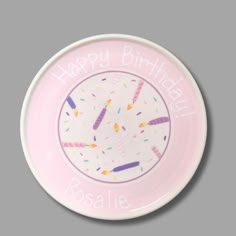 a pink plate with sprinkles on it that says happy birthday rosite