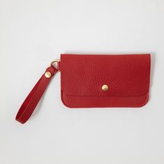 The wristlet clutch is our most versatile leather clutch, with plenty of space for your cards, keys, and phone. It's made of the same beautiful full-grain leathers as our bestselling leather tote bags and can be embossed with your initials at no additional charge. The clutch measures 8.5 inches by 5.25 inches and comes standard with a 5.5-inch wristlet strap, which is permanently affixed to a D-ring on one side of the clutch. Alternately, you can customize your clutch to wear it as a small cross Leather Wristlet With Cell Phone Pocket For Daily Use, Modern Clutch With Wrist Strap For Daily Use, Classic Wristlet Pouch For Everyday Use, Leather Wristlet With Wrist Strap For Everyday Use, Modern Wristlet Clutch For Everyday Use, Classic Everyday Wristlet Pouch, Classic Rectangular Wristlet For Everyday, Modern Rectangular Clutch With Wrist Strap, Classic Everyday Pouch Wristlet