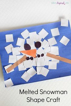 a snowman shape craft made out of construction paper and cut into squares to make it