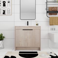 a bathroom with a sink, mirror and towel rack on the wall next to it