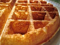 a waffle sitting on top of a white plate