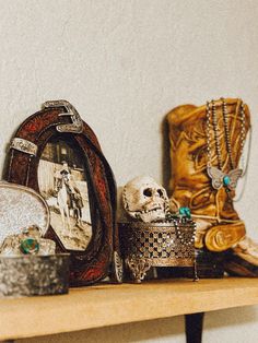 there are many different items on the shelf next to each other, including boots and jewelry