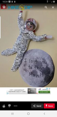 an image of a man on the moon made out of tin foil with words that read i love you to the moon