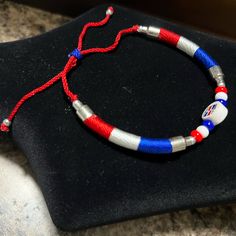 Dominican Red, White, And Blue Bracelet. Drawstring Brand New. For Unisex. Blue Adjustable Bracelets For 4th Of July, Adjustable Blue Jewelry For 4th Of July, Adjustable Red Beaded Bracelets For 4th Of July, Adjustable Friendship Bracelets For 4th Of July, Casual Multicolor Bracelets For 4th Of July, Casual Blue Bracelets For 4th Of July, Adjustable Bracelets For Beach And 4th Of July, Adjustable Beach Bracelets For 4th Of July, Patriotic Red Adjustable Beaded Bracelet