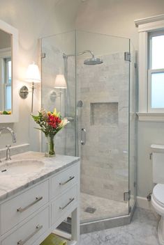 a bathroom with a sink, toilet and shower