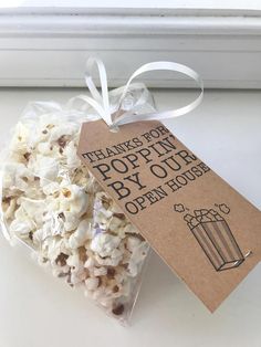 a bag of popcorn sitting next to a window sill