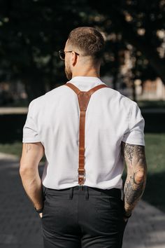 Suspenders are a stylish and unusual alternative to a traditional belt. They are made of durable and high-quality genuine leather, which will make your look more presentable. Leather suspenders will become a highlight of your wardrobe. It will make you stand out from the crowd and help you create a gallant look. Genuine leather suspenders are an ideal accessory for business meetings, various events and celebrations. You can wear them to your own wedding or the wedding of your friends. This is a Formal Leather Belts And Suspenders, Fitted Belts And Suspenders With Adjustable Strap For Business, Elegant Formal Belts And Suspenders With Leather Strap, Elegant Formal Leather Belts And Suspenders, Elegant Formal Leather Strap Belts And Suspenders, Elegant Leather Strap Belts And Suspenders For Formal Occasions, Elegant Leather Suspenders, Elegant Formal Leather Belt And Suspenders, Brown Adjustable Belts And Suspenders