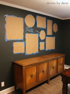 a wall with several pieces of cardboard taped to it and some paint on the walls