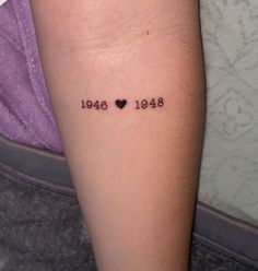 a person with a small tattoo on their arm that says, love is in the air