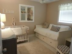 a baby's room with a bed, dresser and crib in the corner