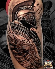 a man's leg with a helmet and wings on it