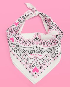 a white bandana with black and pink designs on it