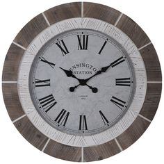 a large clock with roman numerals on the face is shown in grey and white