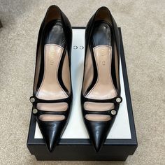 Gucci Mary Jane Pumps. Size 36.5, Black Leather, Mother Of Pearl Buttons, In Good Preowned Condition. Comes With Box And Extra Heel Caps. Mary Jane Pumps, Heel Caps, Gucci Black, Mother Of Pearl Buttons, Pearl Buttons, Gucci Shoes, Accent Colors, Mary Janes, Shoes Women Heels