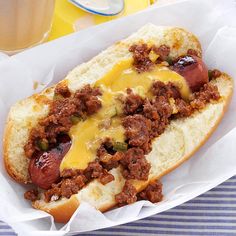 a hot dog with cheese and chili on it