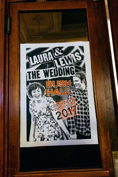 a poster is hanging on the wall in front of a door that says, laura and lewis the wedding bush hall