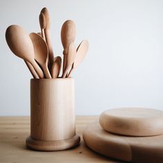 wooden utensils in a cup on a table