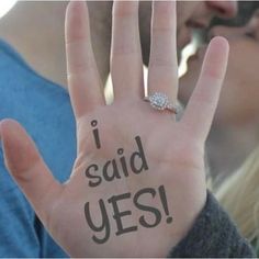 a person holding their hand up with the words i said yes written on it in front of them