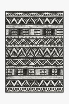 a black and white rug with geometric designs