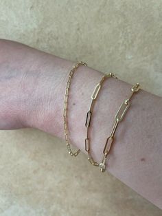 "Super trendy and stylish handmade sterling silver paperclip bracelets 2.5mm, 3mm & 4mm Solid 925 sterling silver with 14k yellow gold finish Stamped \"925\" & \"Italy\" We have in 6-8\" Here is weights for 7\"...if your bracelet is longer or shorter weight will vary slightly 2.5mm- 2g 3mm- 2.7g 4mm- 4.8g Ships fast We also sell matching chains Let us know if any questions" Gold Paperclip Bracelet With Cable Chain For Everyday, Gold Paperclip Bracelet With Cable Chain, Classic 14k Gold Filled Oval Link Paperclip Bracelet, Minimalist 14k Gold Paperclip Bracelet With Lobster Clasp, Yellow Gold Minimalist Paperclip Bracelet With Lobster Clasp, Everyday Handmade Gold Chain Bracelet, Minimalist Yellow Gold Paperclip Bracelet With Lobster Clasp, Gold Paperclip Bracelet Perfect As Gift, Yellow Gold Delicate Paperclip Bracelet Gift