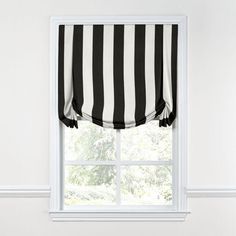 a window with black and white striped curtains