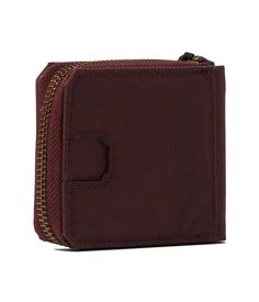 Keep your essentials close at hand with the durable Carhartt Nylon Duck Zipper Wallet. Crafted from hardwearing nylon duck fabric with a zip-around closure to securely hold your cash, cards and ID. Featuring one exterior slip pocket perfect for receipts and tickets, plus an interior slip pocket for bills. Inside also includes six credit card slots to keep your most-used cards organized and an exterior patch with the Carhartt logo. Lightweight at just 2oz yet handsomely made to protect your daily essentials on the go. Functional Everyday Wallets With Zipper Closure, Functional Wallets With Zipper Closure, Burgundy Wallet With Card Slots For Daily Use, Burgundy Travel Wallet With Card Slots, Burgundy Wallets With Card Slots For Daily Use, Everyday Brown Vegetable-tanned Wallet, Carhartt Bag, Red Wallet With Zipper Closure For Daily Use, Carhartt Logo