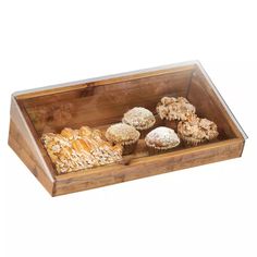 a wooden box filled with lots of different types of pastries and muffins