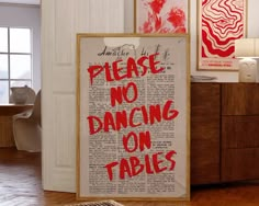 there is a sign that says please no dancing on tables in front of the door