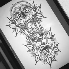 a drawing of two skulls and roses on a white paper with blue ink in the middle