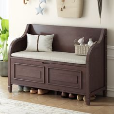 a wooden bench with storage drawers underneath it