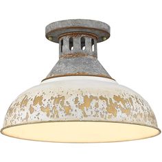 an old fashioned light fixture with rusted paint on the bottom and metal trims