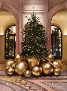 a large christmas tree is surrounded by gold balls