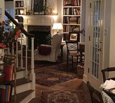 a living room filled with furniture and a fire place