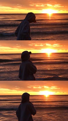 the sun is setting over the ocean with two people standing on the beach looking out at the water