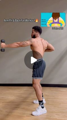 a man with no shirt is holding two dumbbells