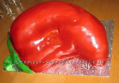 a large red pepper sitting on top of a table