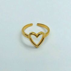 Heart ring, gold ring , adjustable ring , minimalist ring , stackable rings , rings for women , dainty ring , 24k gold filled brass ring This heart ring is 24k gold plated brass It is adjustable and can fit 6-8.5 size finger. It is high quality and can be worn as stackable ring combinations. Wonderful friendship gift and minimalistic design that can be loved by every girl Minimalist Adjustable Heart-shaped Midi Rings, Adjustable Heart-shaped Yellow Gold Midi Rings, Adjustable Yellow Gold Heart Midi Rings, Minimalist Adjustable Yellow Gold Heart Ring, Adjustable Gold Heart Ring, Adjustable Minimalist Gold Heart Ring, Adjustable Minimalist Midi Rings For Valentine's Day, Adjustable Gold Midi Rings For Valentine's Day, Ring Combinations