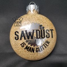 a glass ornament with the words sawdust on it