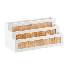 two white trays with wicker handles on each side