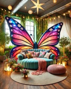 a living room filled with furniture and a large butterfly mural on the wall above it