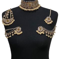 Handcrafted champagne antique golden kundan Indian wedding / bridal jewellery set. Set includes- Earrings with multilayer pearl sahara  Choker necklace Jhumar Tikka  Our choker is adjustable with a dori at the back giving you a comfortable fit. It comes with elegant kundan earrings with pearl detail, tikka and jhumar with hooks.  The subtle glimmer of the kundan with elegant pearl detail makes this jewelry set a truly head turning piece, a must have for every jewellery box.  Our ethnic jewellery Gold Kundan Lehenga For Reception, Gold Jewelry Sets With Stone Work For Party, Gold Chandbali Jewelry Sets For Parties, Gold Choker For Wedding And Festive Occasions, Gold Wedding Choker For Festive Occasions, Ceremonial Gold Lehenga For Diwali, Gold Lehenga For Diwali Ceremonial Occasion, Gold Festive Wedding Choker, Gold Bridal Sets For Reception And Diwali