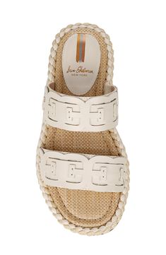 A ropey midsole and woven footbed further the summery feel of this strappy banded leather sandal. Leather upper/synthetic lining and sole Imported Beige Woven Leather Sandals With Flat Heel, Beige Woven Sandals With Flat Heel, Beige Woven Flat Heel Sandals, Beige Woven Flat Sandals, Cream Leather Sandals With Woven Sole, Cream Sandals With Textured Sole For Summer, Beige Woven Leather Sandals With Round Toe, Cream Textured Sole Sandals For Summer, Beige Synthetic Slides With Woven Sole