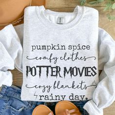 Product Title: "Pumpkin Spice, Comfy Clothes, Potter Movies, Cozy Blankets, Rainy Day" Sweatshirt - Ultimate Fall Vibes Description: Embrace the cozy season in style with our "Pumpkin Spice, Comfy Clothes, Potter Movies, Cozy Blankets, Rainy Day" sweatshirt! This perfect fall essential combines everything we love about autumn into one cozy piece. Whether you're sipping on your favorite pumpkin spice latte or curled up on the couch for a movie marathon, this sweatshirt is made for those who live Cozy Crew Sweatshirt For Fall, Cozy Holiday Sweatshirt For Fall, Its Fall Yall Sweater, Cozy Text Print Sweatshirt For Fall, Spooky Crew Neck Sweatshirt For Fall, Pod House, Holiday Attire, Halloween Sweater, Fall Essentials