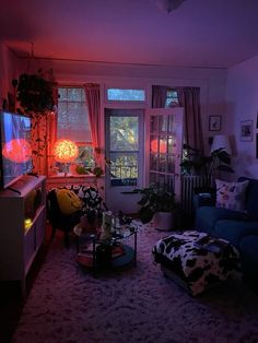 a living room filled with furniture and a flat screen tv