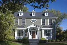 an image of a gray house with white trim