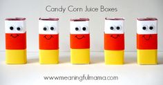 four candy corn juice boxes with faces painted on them and the words candy corn juice boxes