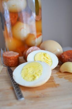 hard boiled eggs and other ingredients on a cutting board